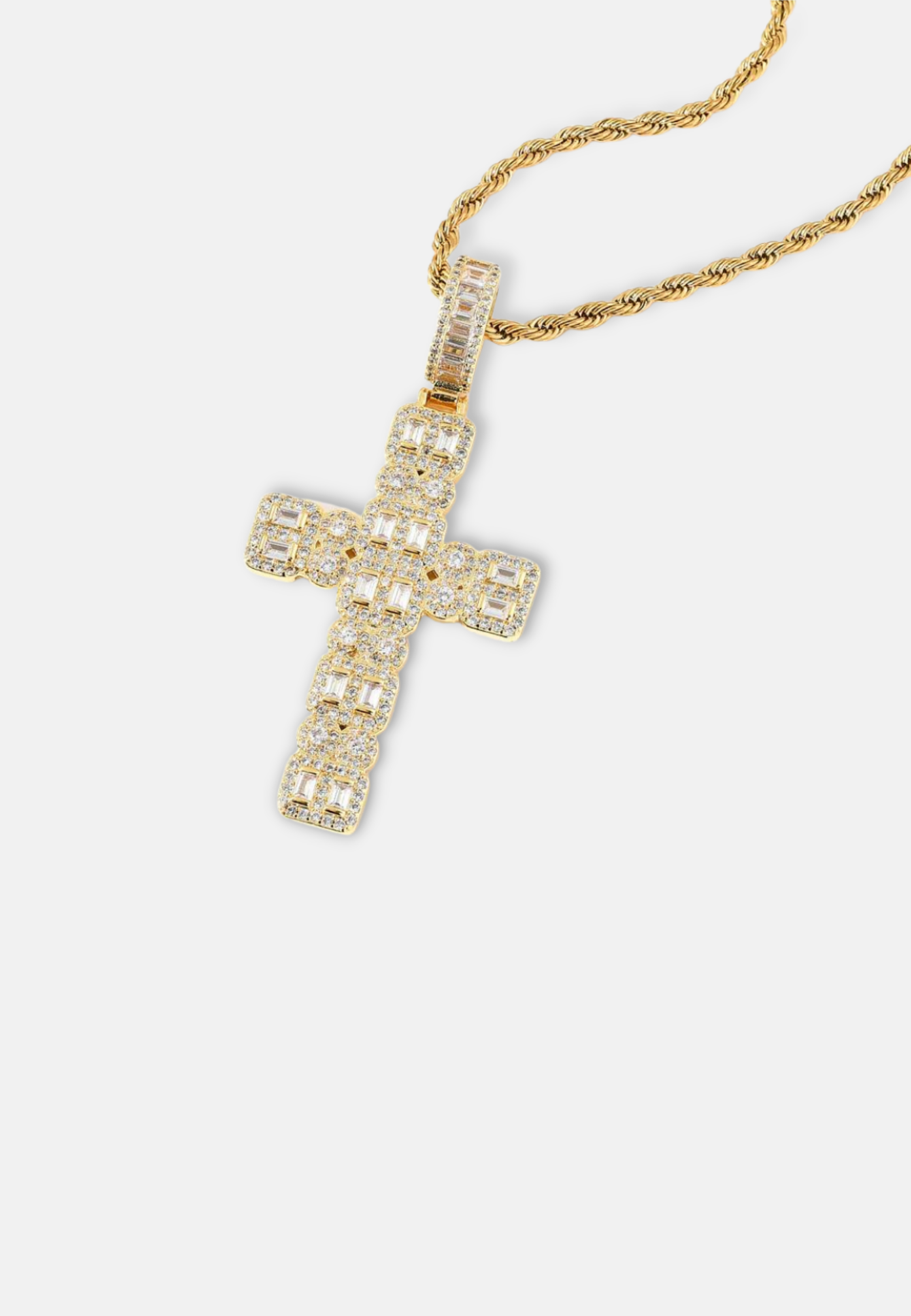 Hillenic Gold Iced Mixed Cross Pendant, absolute best seller in hip hop jewelry industry lying on the white surface